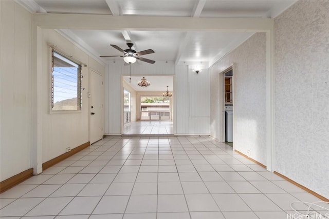 interior space with beamed ceiling, plenty of natural light, light tile patterned flooring, and ceiling fan with notable chandelier