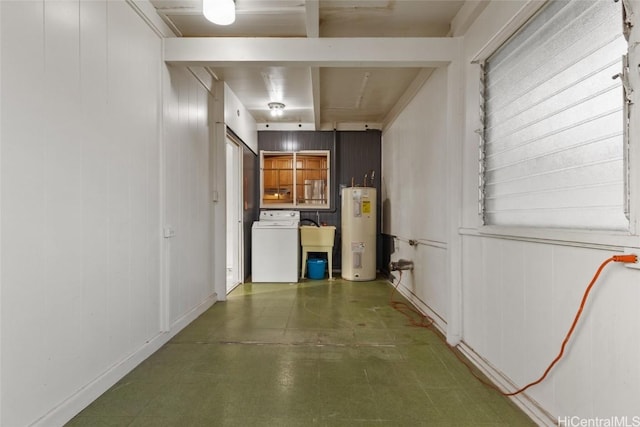 basement with washer / dryer, electric water heater, and sink