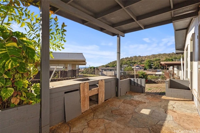 view of patio / terrace with area for grilling and an outdoor bar