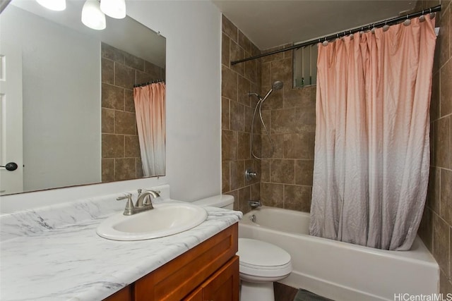 full bathroom featuring shower / tub combo with curtain, vanity, and toilet