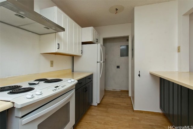 kitchen with extractor fan, light hardwood / wood-style flooring, white cabinets, and white electric range oven