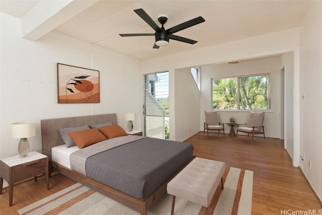 bedroom with ceiling fan and hardwood / wood-style floors