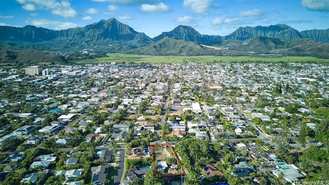 birds eye view of property featuring a mountain view