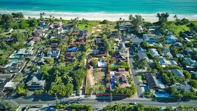 bird's eye view with a water view and a view of the beach