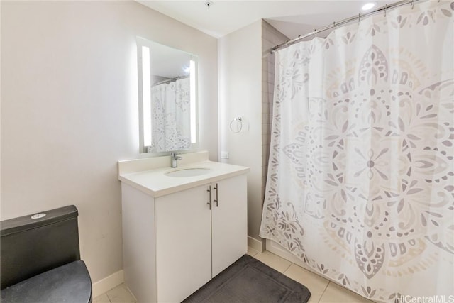 bathroom featuring vanity, curtained shower, and tile patterned floors