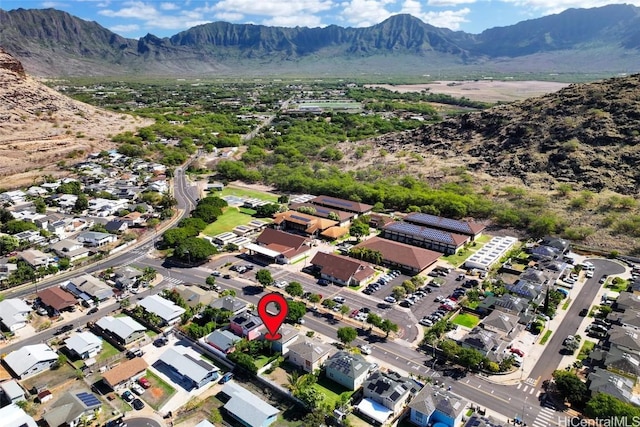 birds eye view of property with a mountain view