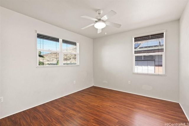 empty room featuring hardwood / wood-style flooring and ceiling fan