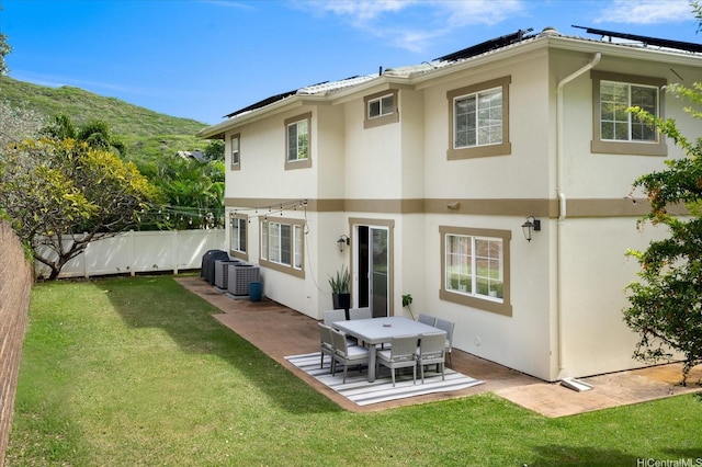 1098 Kuekue St, Honolulu, HI 96825 - rear view of property featuring stucco siding, a patio area, central air condition unit, and a mountain view