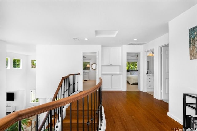 1098 Kuekue St, Honolulu, HI 96825 - hallway with an upstairs landing, dark wood-style flooring, attic access, and recessed lighting