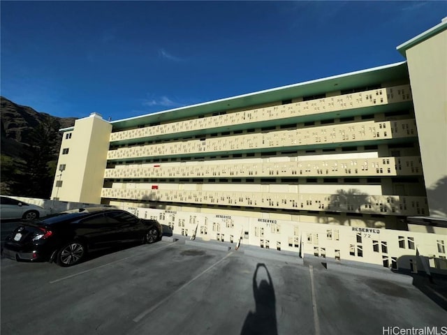 view of building exterior with a mountain view