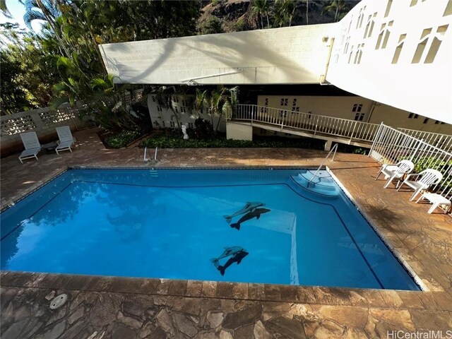 view of swimming pool featuring a patio