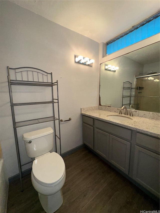 84-265 Farrington Hwy Unit 206, Waianae, HI 96792 - full bathroom featuring toilet, wood finished floors, vanity, a shower with door, and baseboards
