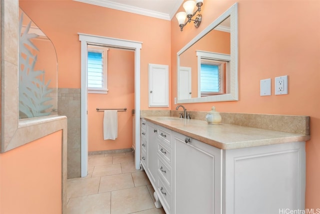 bathroom with crown molding, tile patterned floors, and vanity