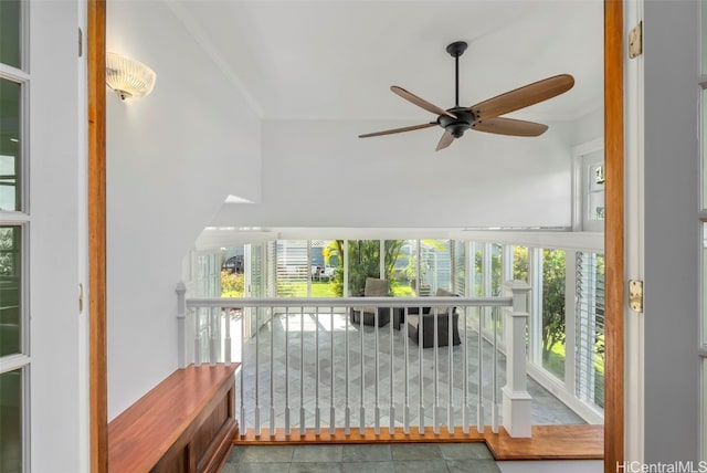 interior space featuring crown molding and ceiling fan