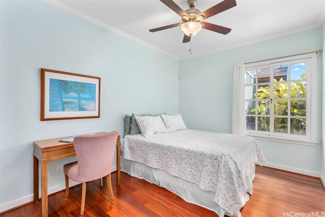 bedroom with ornamental molding, hardwood / wood-style floors, and ceiling fan