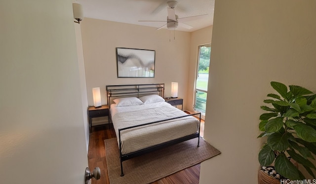 bedroom with ceiling fan and hardwood / wood-style floors