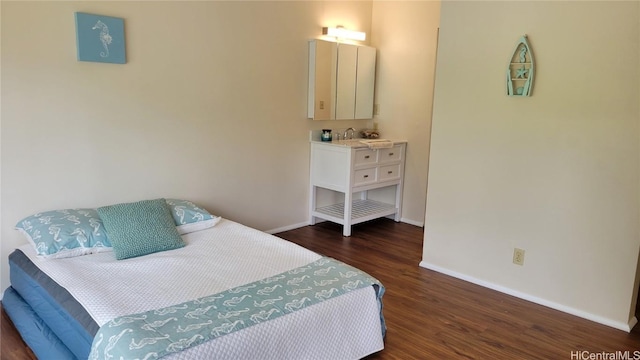 bedroom with dark hardwood / wood-style flooring