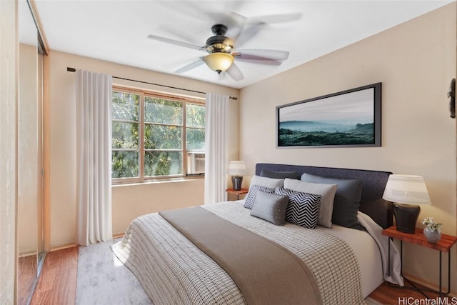 bedroom featuring a ceiling fan and wood finished floors