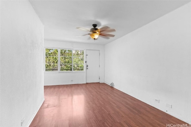 unfurnished room featuring ceiling fan and wood finished floors