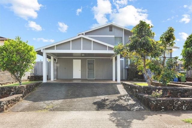 view of front of property featuring a carport and aphalt driveway