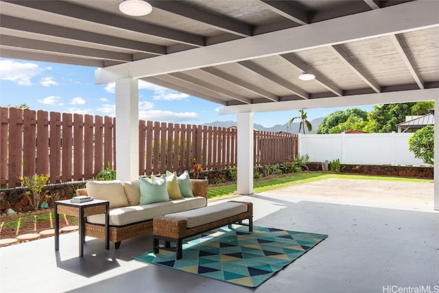 view of patio featuring a fenced backyard and an outdoor living space