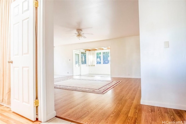 unfurnished room featuring ceiling fan and light wood-type flooring