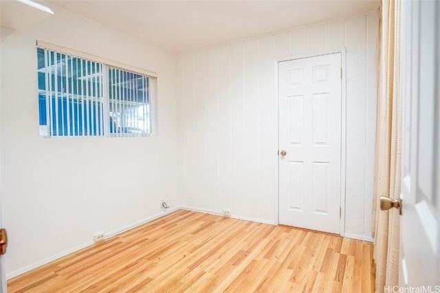 empty room featuring wood-type flooring