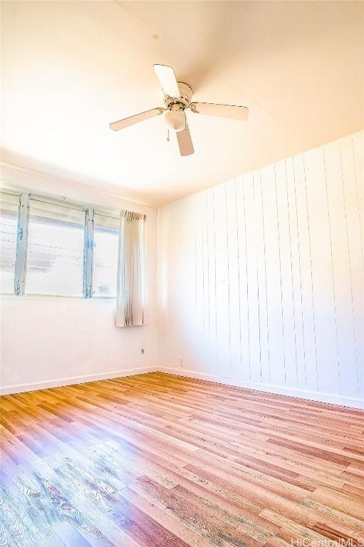 empty room featuring light hardwood / wood-style flooring and ceiling fan