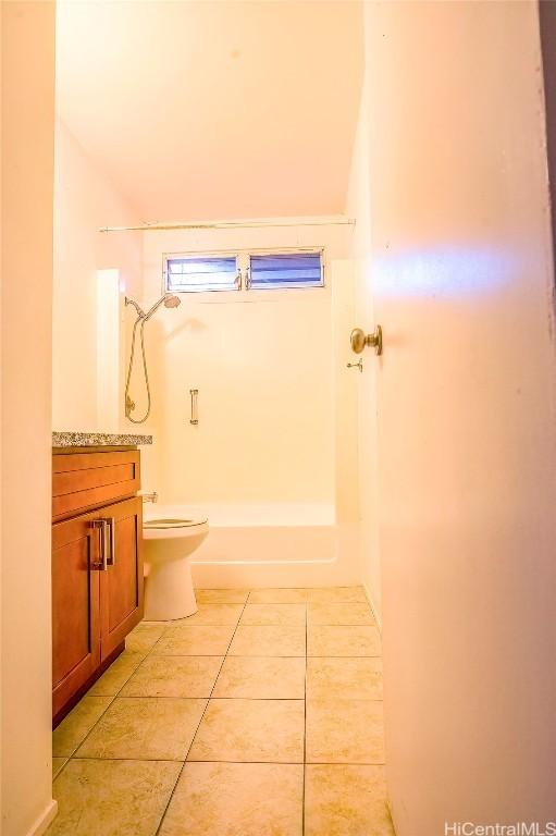 bathroom with vanity, tile patterned floors, and toilet