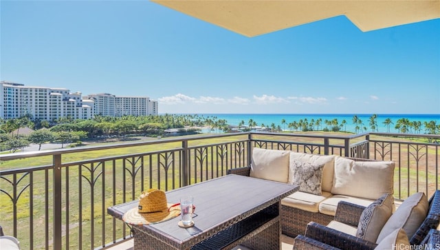 balcony featuring a water view