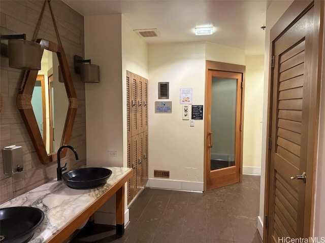 bathroom with sink and a mail area