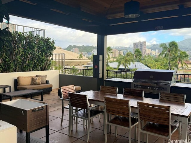 view of patio / terrace with a mountain view, outdoor lounge area, area for grilling, and ceiling fan