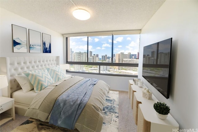 carpeted bedroom with a textured ceiling