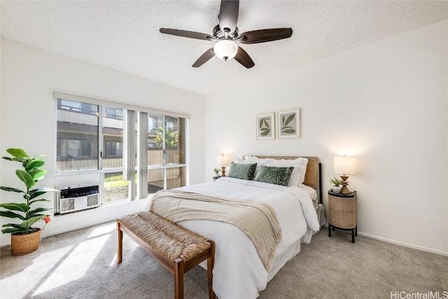 bedroom with access to outside, light colored carpet, a textured ceiling, and cooling unit