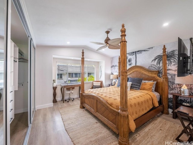 bedroom with vaulted ceiling, hardwood / wood-style floors, and ceiling fan