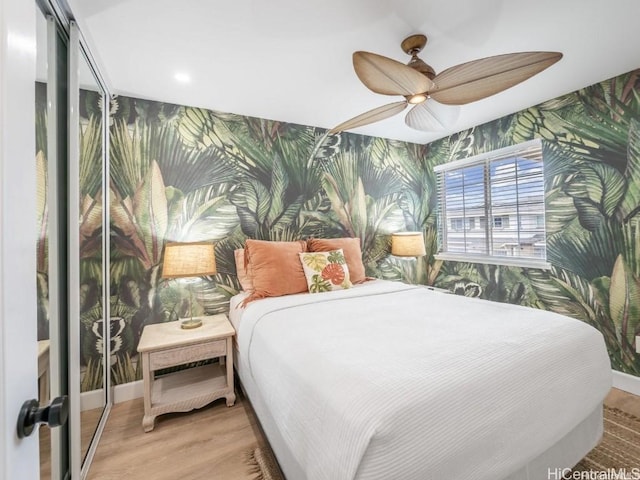 bedroom featuring ceiling fan and light wood-type flooring