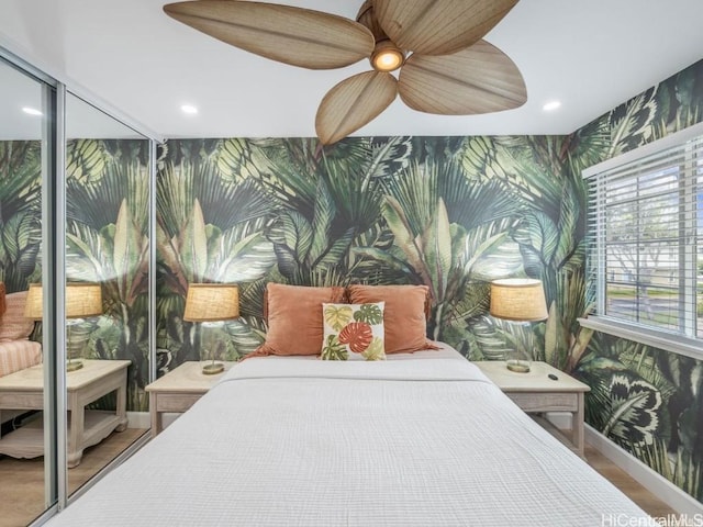 bedroom featuring hardwood / wood-style floors and ceiling fan