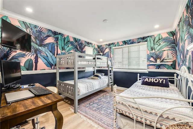 bedroom with crown molding and hardwood / wood-style flooring