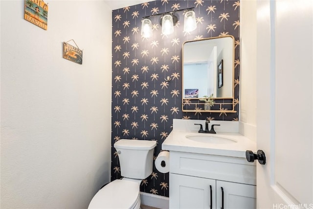 bathroom with vanity and toilet