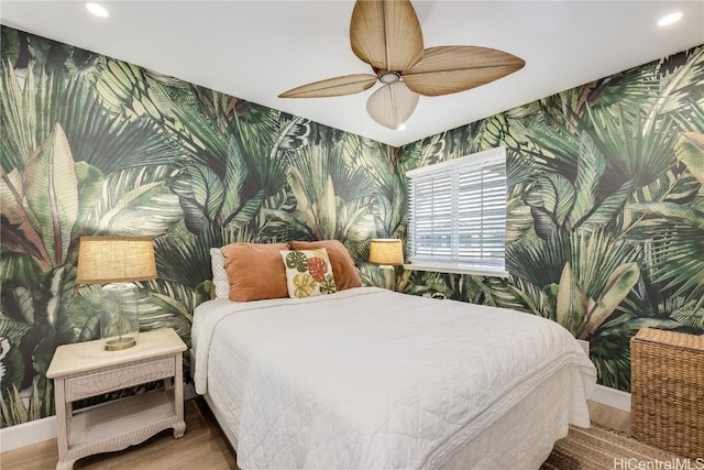 bedroom with wood-type flooring and ceiling fan