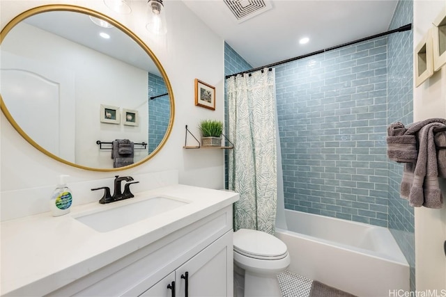 full bathroom featuring vanity, shower / bath combination with curtain, and toilet