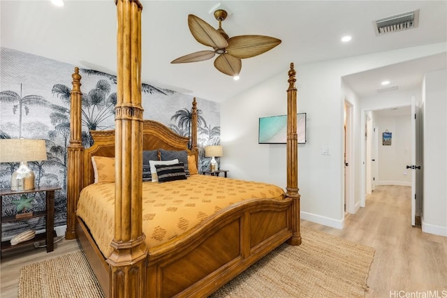 bedroom featuring vaulted ceiling, ceiling fan, and light wood-type flooring