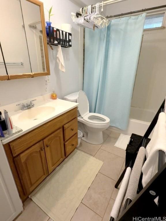 full bathroom with vanity, toilet, tile patterned flooring, and shower / bath combo with shower curtain