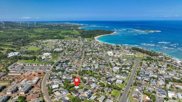 aerial view with a water view and a beach view