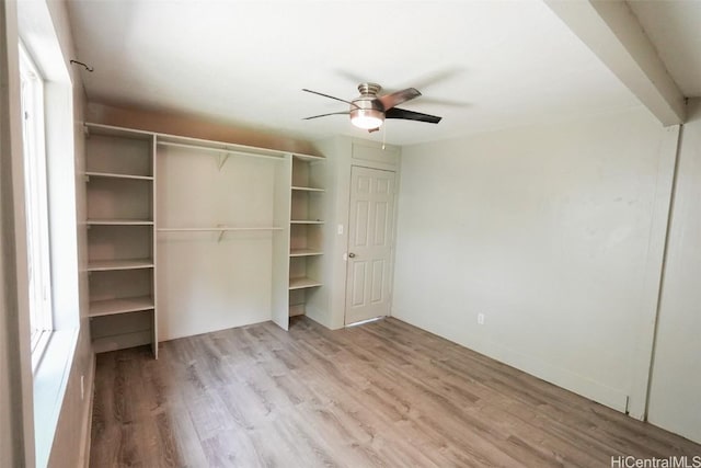 unfurnished bedroom featuring light hardwood / wood-style flooring, a closet, and ceiling fan