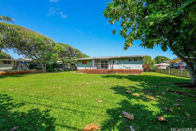 view of yard with a wooden deck