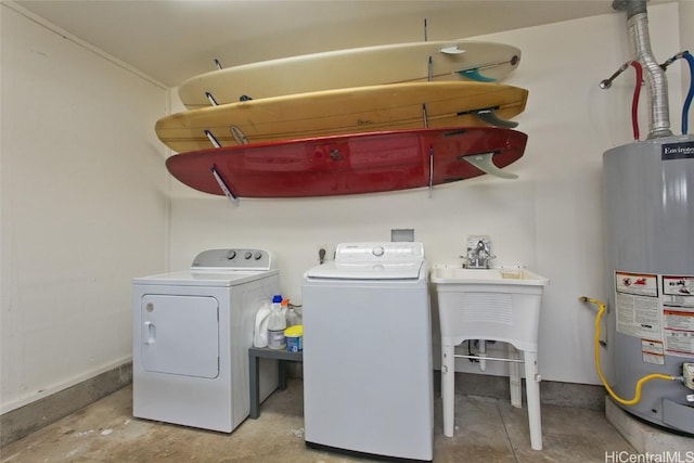 laundry room featuring washer and dryer and water heater