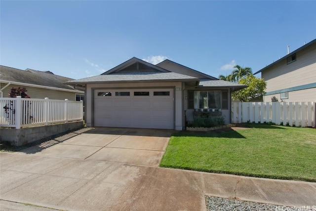 ranch-style house featuring a garage and a front yard