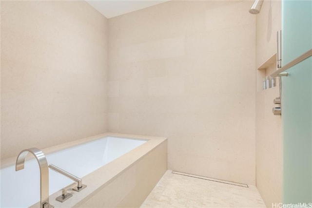 bathroom with tile walls