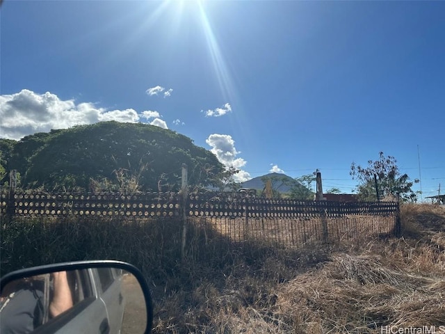 view of mountain feature with a rural view